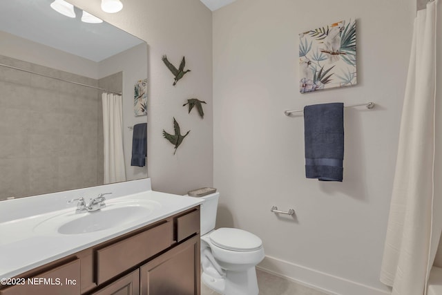 bathroom featuring a shower with shower curtain, vanity, and toilet