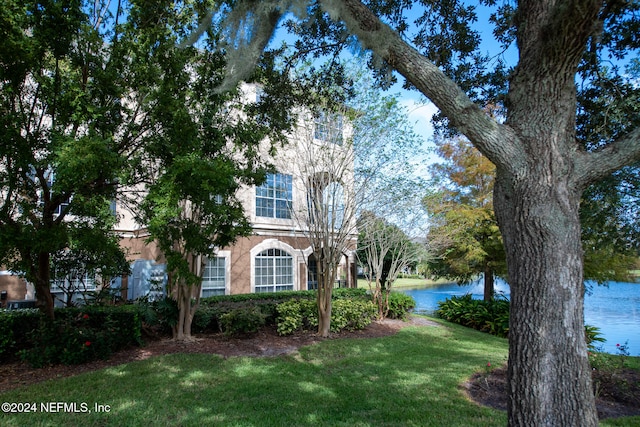 view of front of home featuring a water view and a front yard