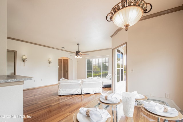 10961 Burnt Mill Rd Unit 421, Jacksonville, FL 32256 - living area with wood finished floors, ornamental molding, arched walkways, and ceiling fan
