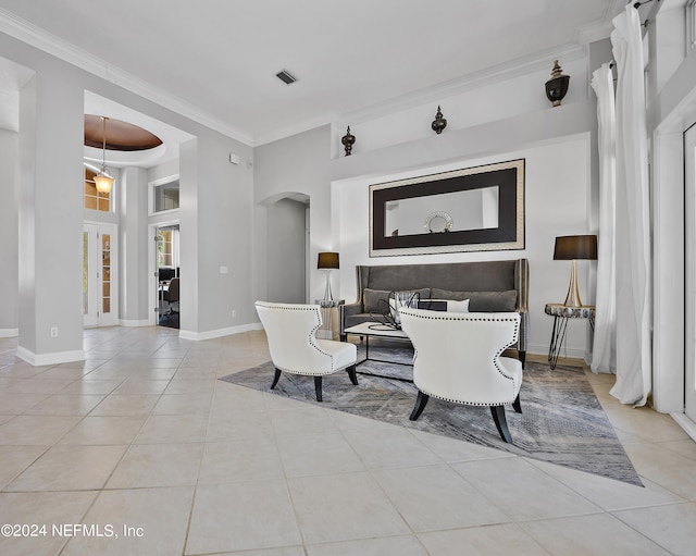 dining room with light tile patterned flooring and ornamental molding