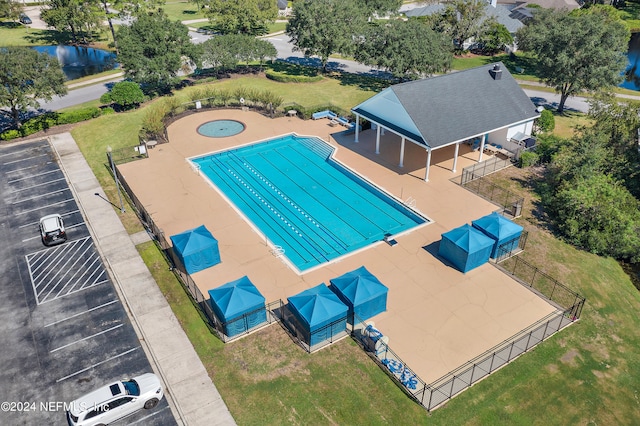 view of swimming pool with a water view