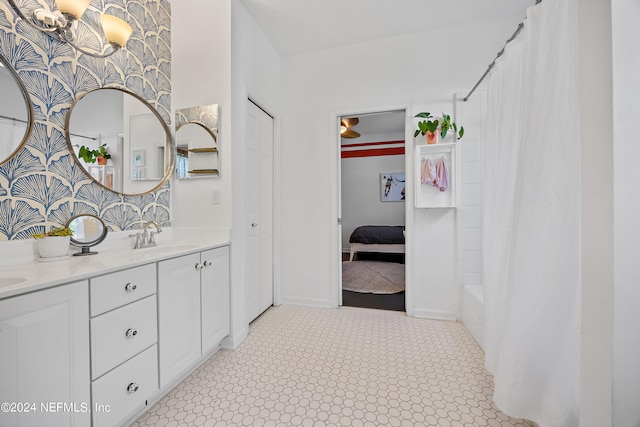 bathroom featuring vanity and shower / tub combo with curtain