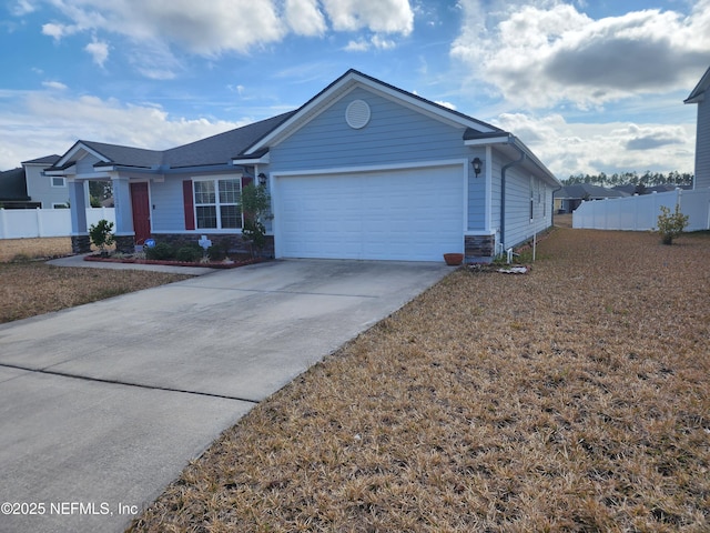 ranch-style house with central AC and a garage