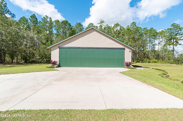 garage featuring a lawn