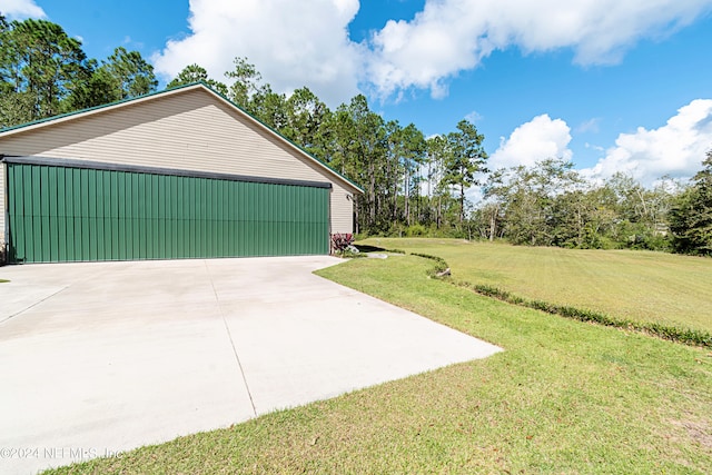 garage with a yard