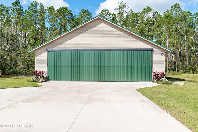 garage with a yard