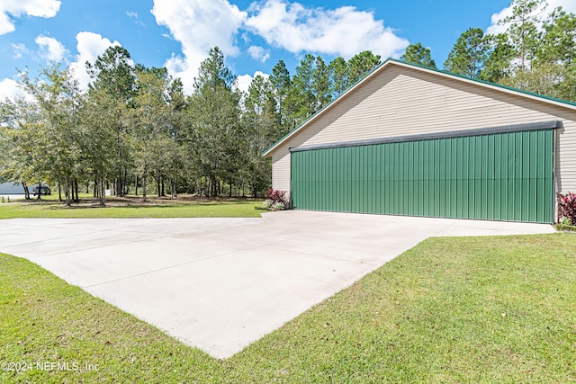 garage with a yard