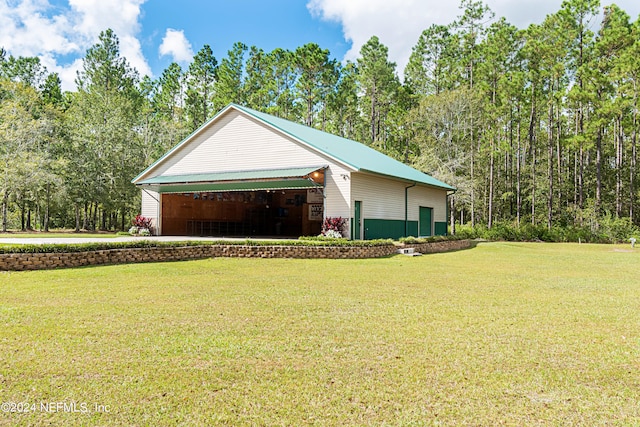 view of property exterior with a lawn