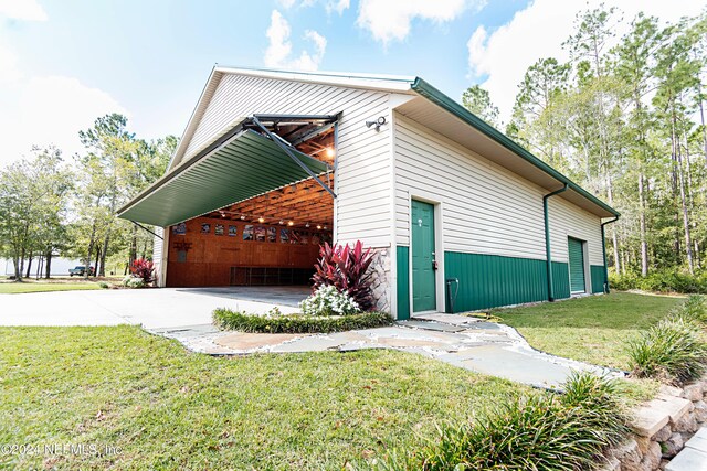 11111 Apache Ln, Glen St Mary, FL 32040 - view of property exterior featuring a lawn and concrete driveway