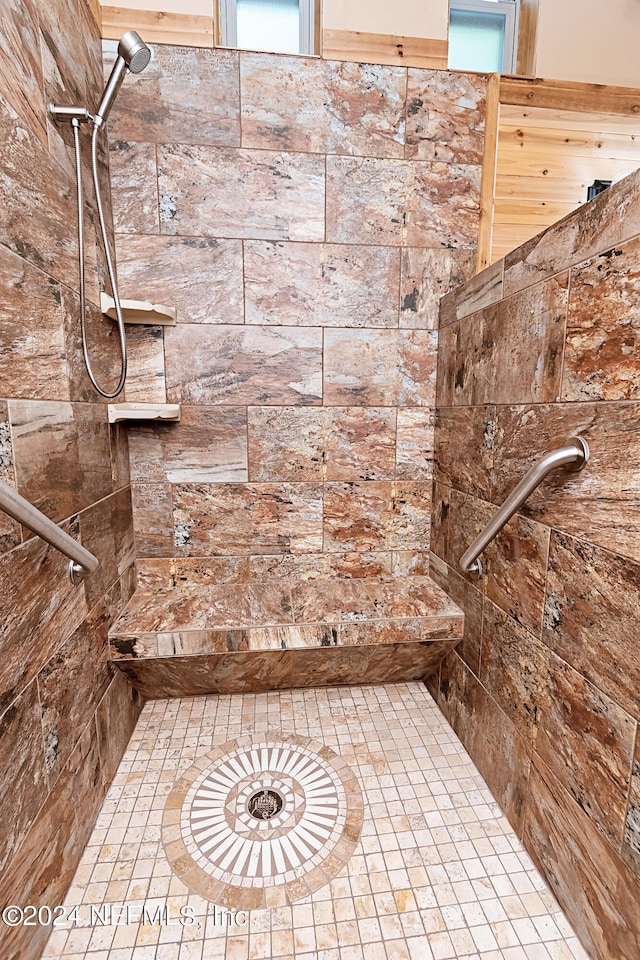 bathroom featuring tiled shower