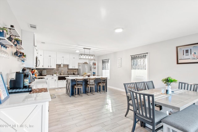 dining room featuring light wood-type flooring