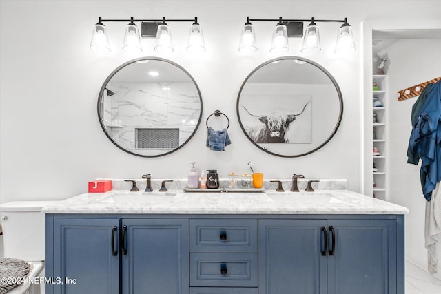 bathroom with tile patterned flooring, walk in shower, and vanity