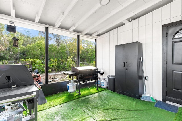 sunroom / solarium with lofted ceiling