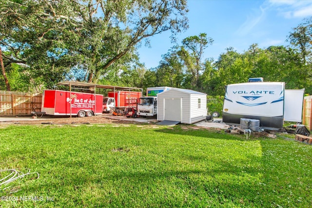 view of yard with a storage unit