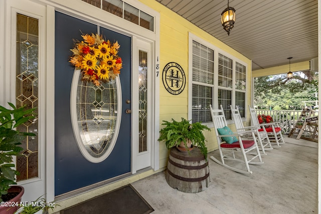 doorway to property featuring a porch