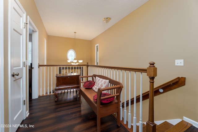 sitting room with dark hardwood / wood-style floors and a chandelier