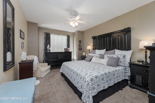 carpeted bedroom with ceiling fan