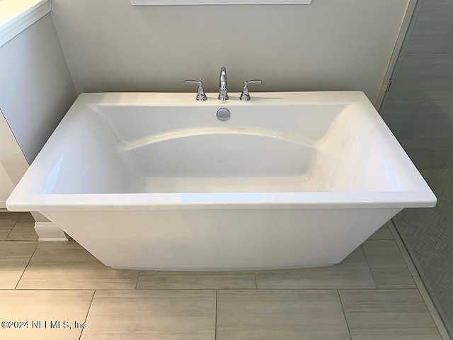 full bathroom with a soaking tub