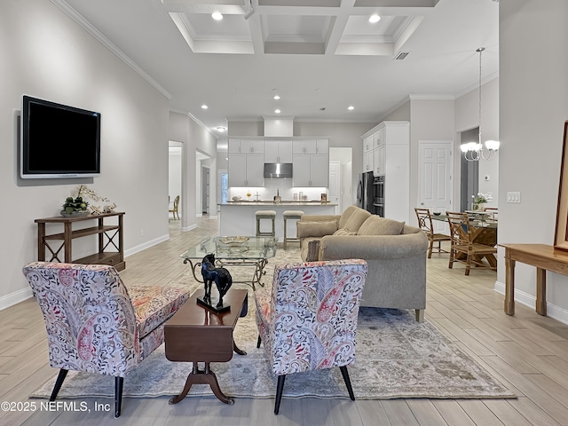 living area with light wood-type flooring, baseboards, and a notable chandelier