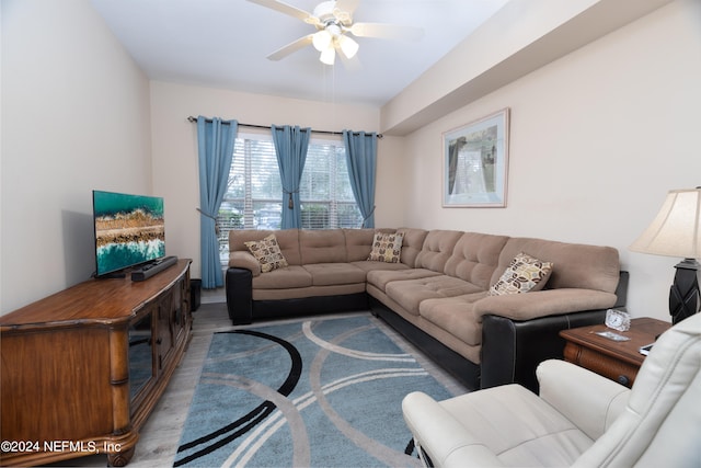 living room with hardwood / wood-style flooring and ceiling fan