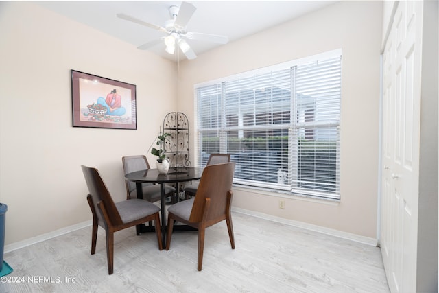 dining area featuring light hardwood / wood-style floors and ceiling fan