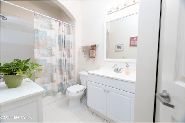 full bathroom with shower / bath combination with curtain, vanity, tile patterned flooring, and toilet