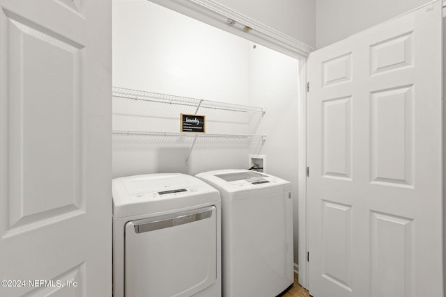 washroom with independent washer and dryer