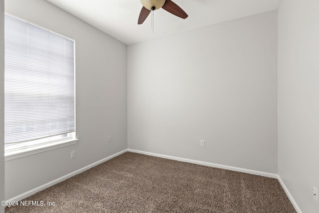 carpeted empty room with ceiling fan