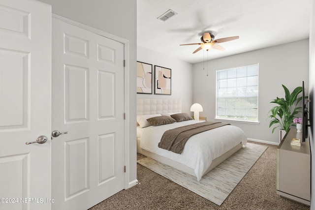 carpeted bedroom featuring ceiling fan