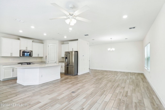 270 Clifton Bay Lp, Saint Johns, FL 32259 - kitchen with light wood-type flooring, visible vents, light countertops, open floor plan, and appliances with stainless steel finishes