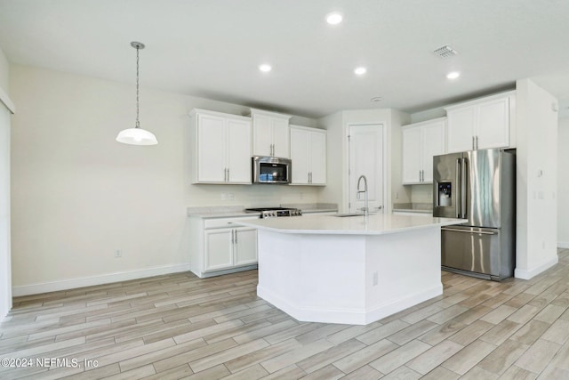 270 Clifton Bay Lp, Saint Johns, FL 32259 - kitchen with a sink, light wood-type flooring, recessed lighting, light countertops, and appliances with stainless steel finishes