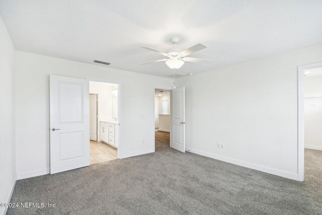 270 Clifton Bay Lp, Saint Johns, FL 32259 - unfurnished bedroom with baseboards, light carpet, and a spacious closet