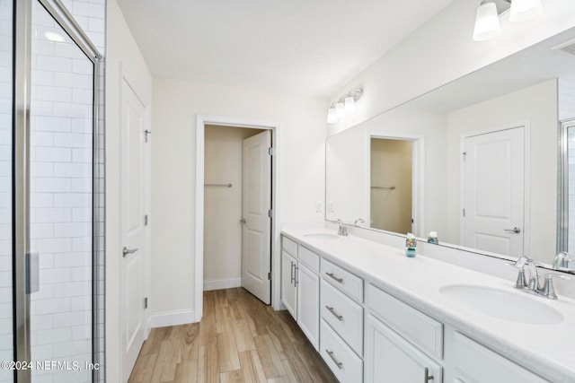 270 Clifton Bay Lp, Saint Johns, FL 32259 - bathroom with a sink, double vanity, baseboards, and wood finished floors