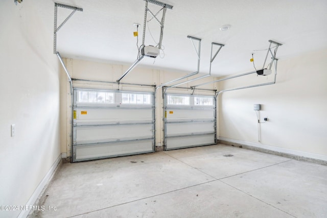 270 Clifton Bay Lp, Saint Johns, FL 32259 - garage featuring baseboards and a garage door opener
