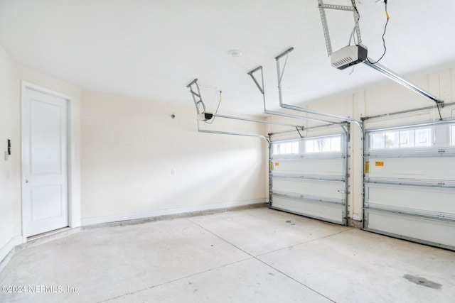 270 Clifton Bay Lp, Saint Johns, FL 32259 - garage with baseboards and a garage door opener