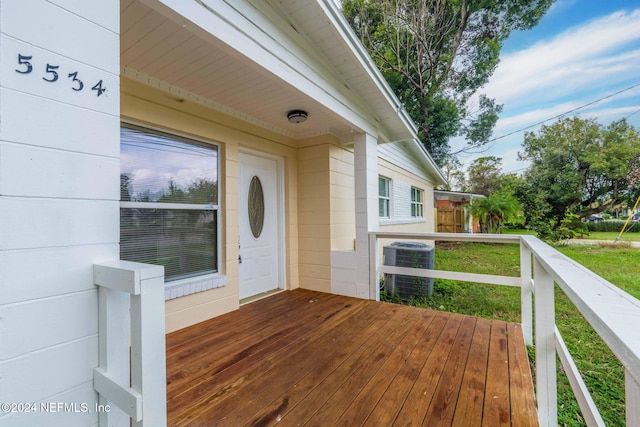 wooden deck with central air condition unit