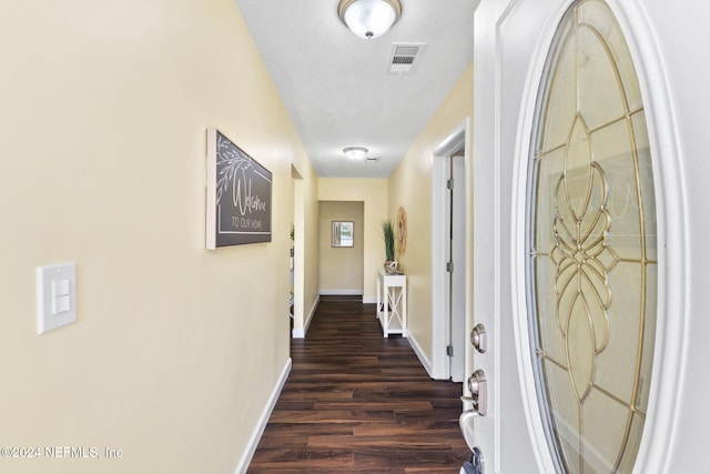 corridor featuring dark hardwood / wood-style floors