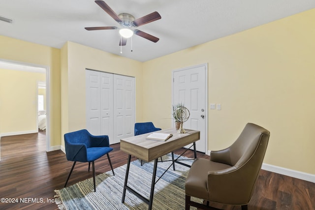 office with dark wood-type flooring and ceiling fan