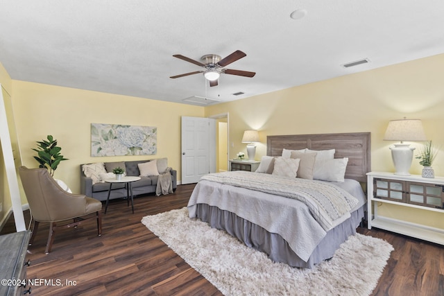 bedroom featuring ceiling fan and dark hardwood / wood-style floors