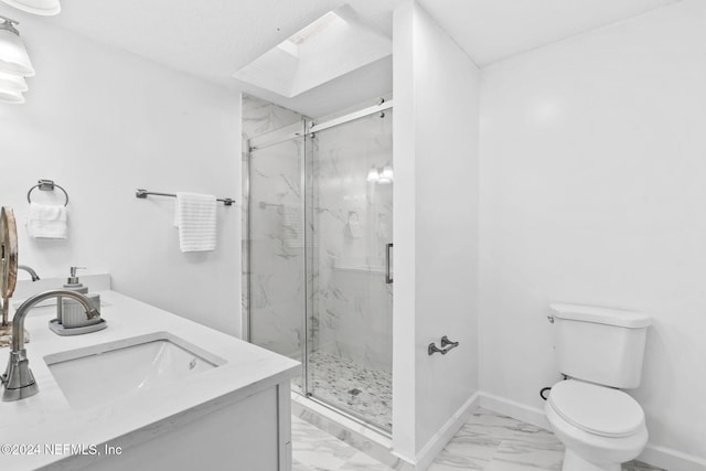 bathroom featuring toilet, vanity, a skylight, and walk in shower