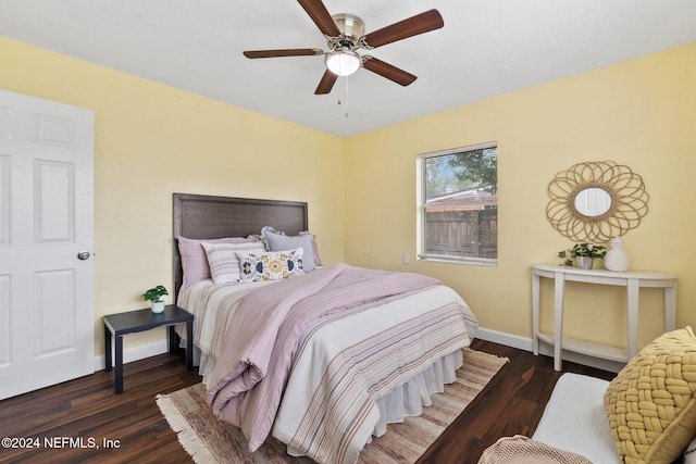 bedroom with dark wood-type flooring and ceiling fan