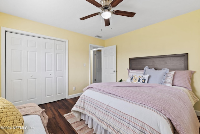 bedroom featuring ceiling fan, a closet, and dark hardwood / wood-style flooring