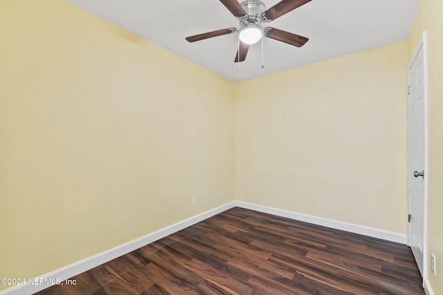 empty room featuring ceiling fan and dark hardwood / wood-style floors