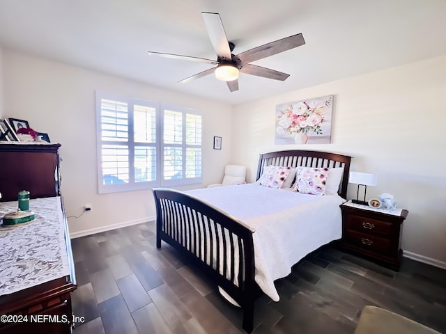 bedroom featuring ceiling fan and dark wood-type flooring