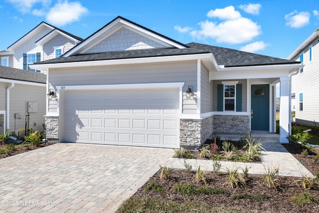 view of front of home featuring a porch and a garage