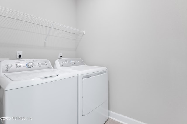 laundry area with independent washer and dryer