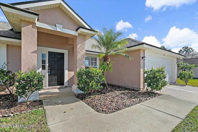 property entrance with a garage