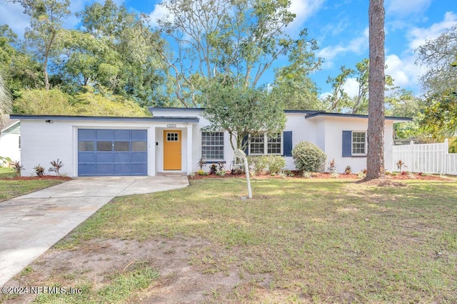 single story home with a front yard and a garage