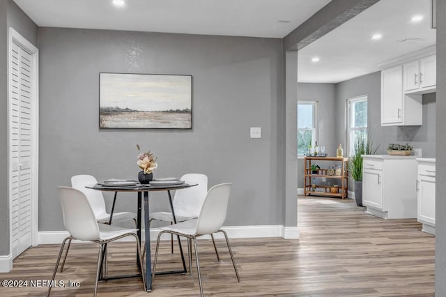 dining space with light hardwood / wood-style flooring