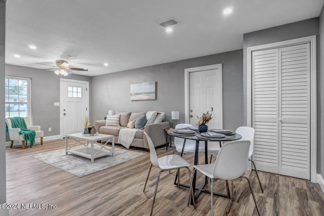 dining space featuring ceiling fan and light hardwood / wood-style flooring